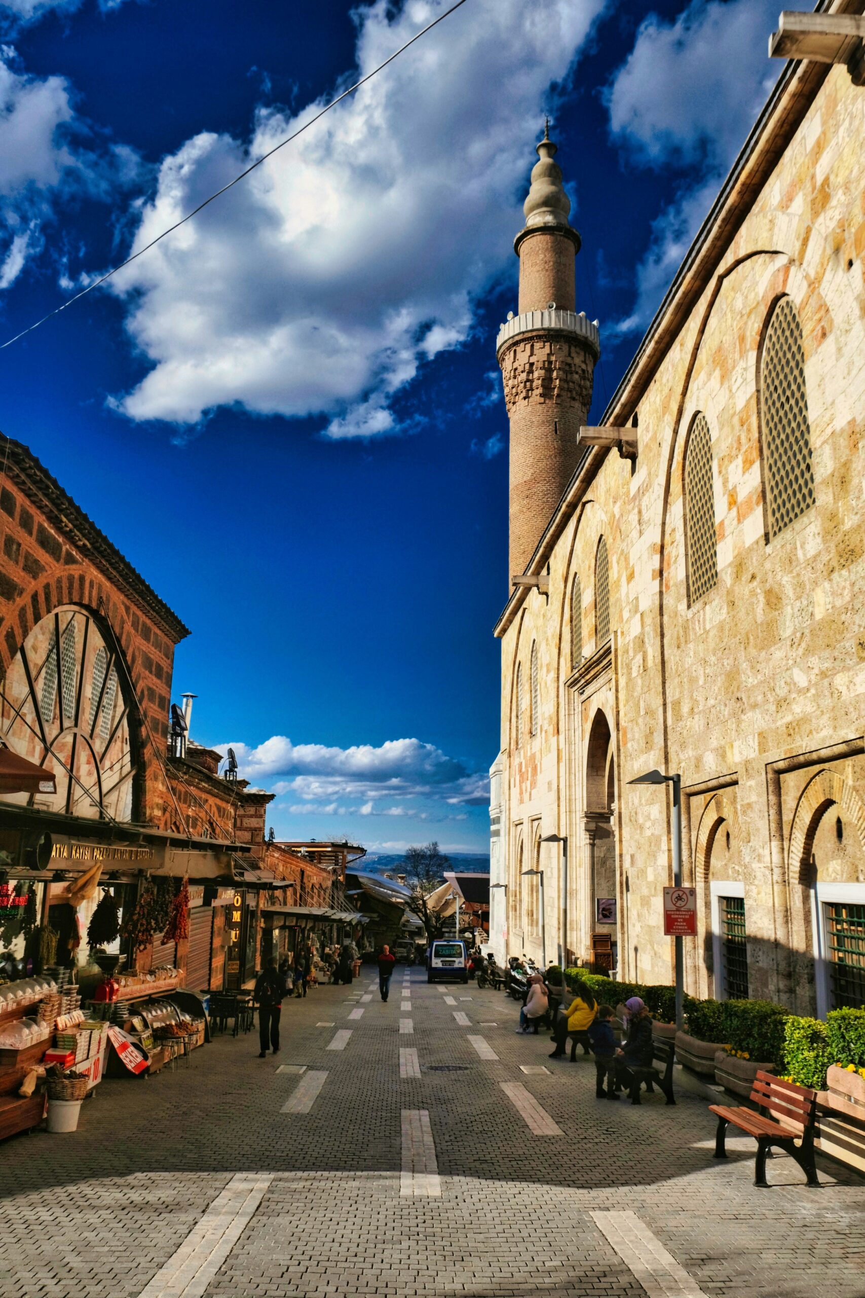 A street lined with buildings and a tall tower. Bursa, Turkey.