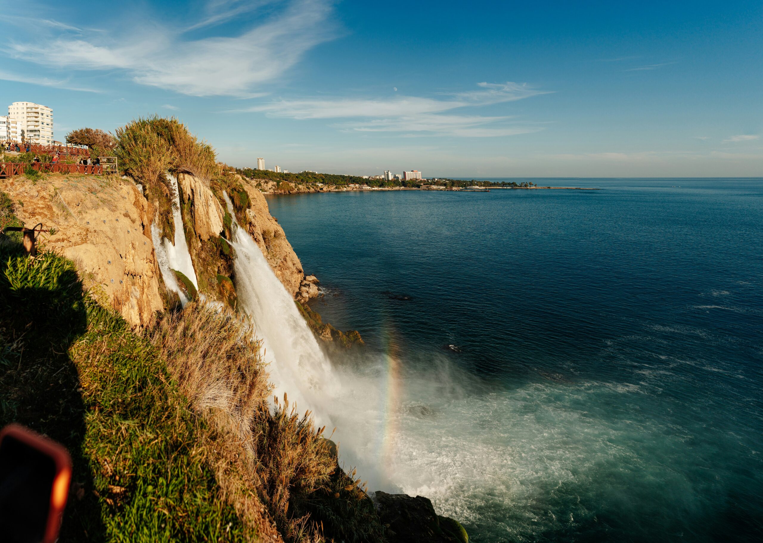 A waterfall with rainbow in the middle. Lower Duden waterfalls in Antalya, Turkey.