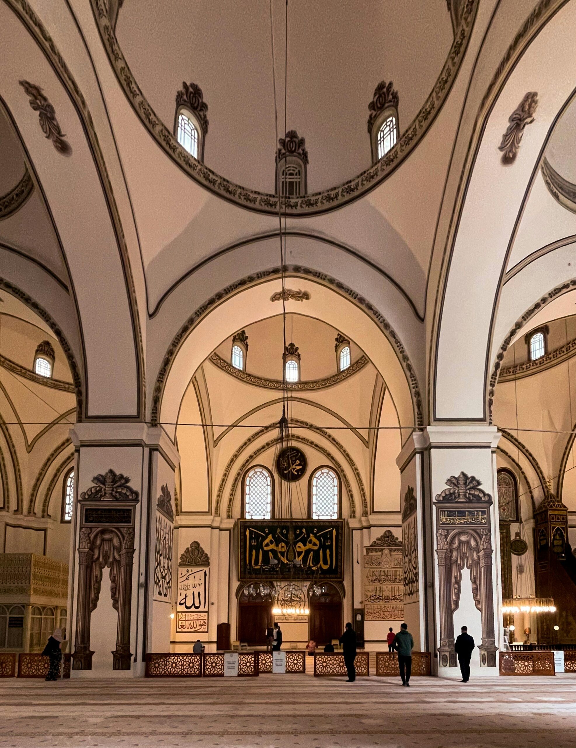 People in the hall of Grand Mosque of Bursa in Turkey.