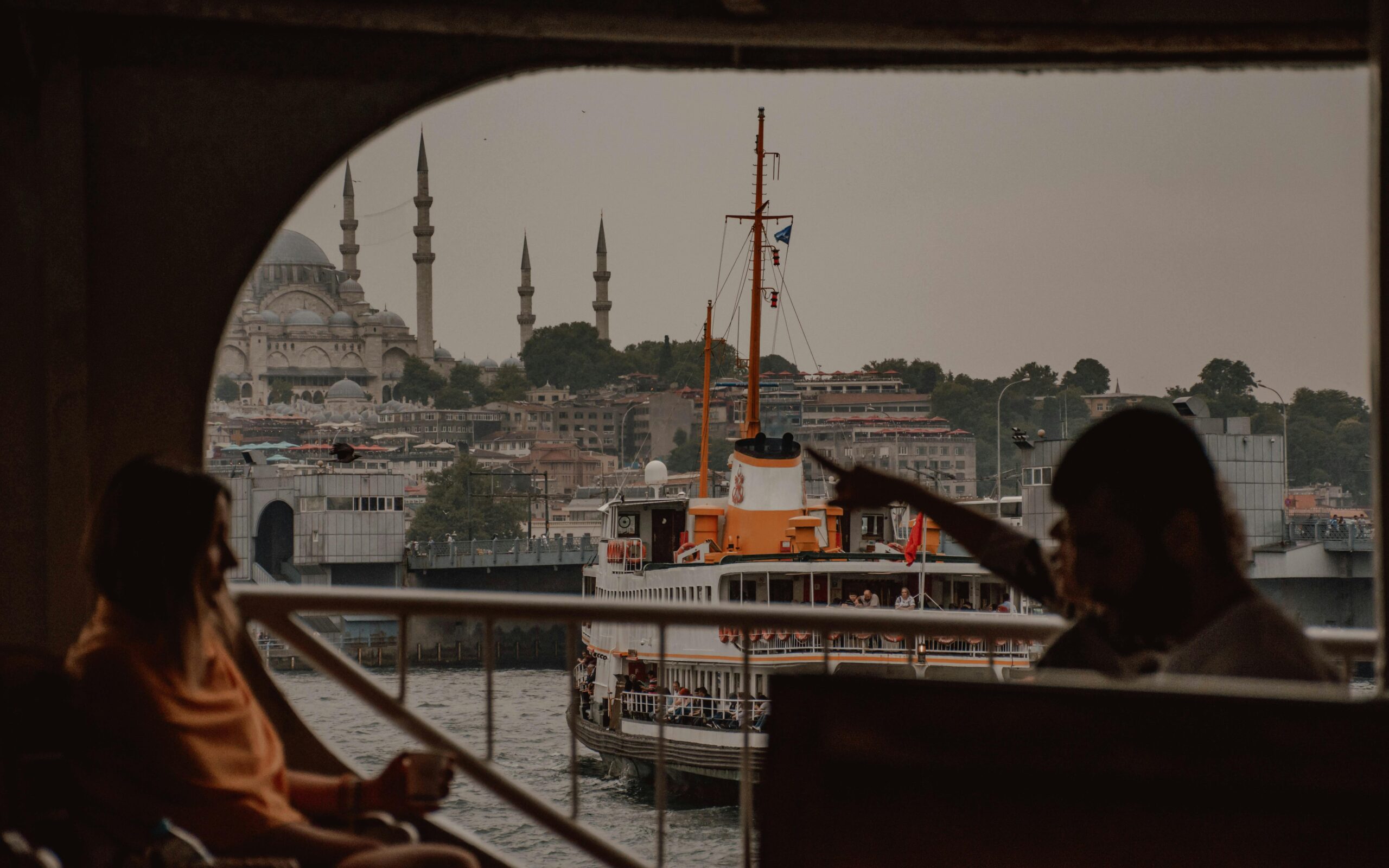 pexels-ibnulharezmi-4463887 - Turkey Family Holidays Anonymous tourists relaxing in cruise ship floating in Bosporus, Istanbul. - Things to Know Before Traveling to Istanbul - Turkey Family Holidays