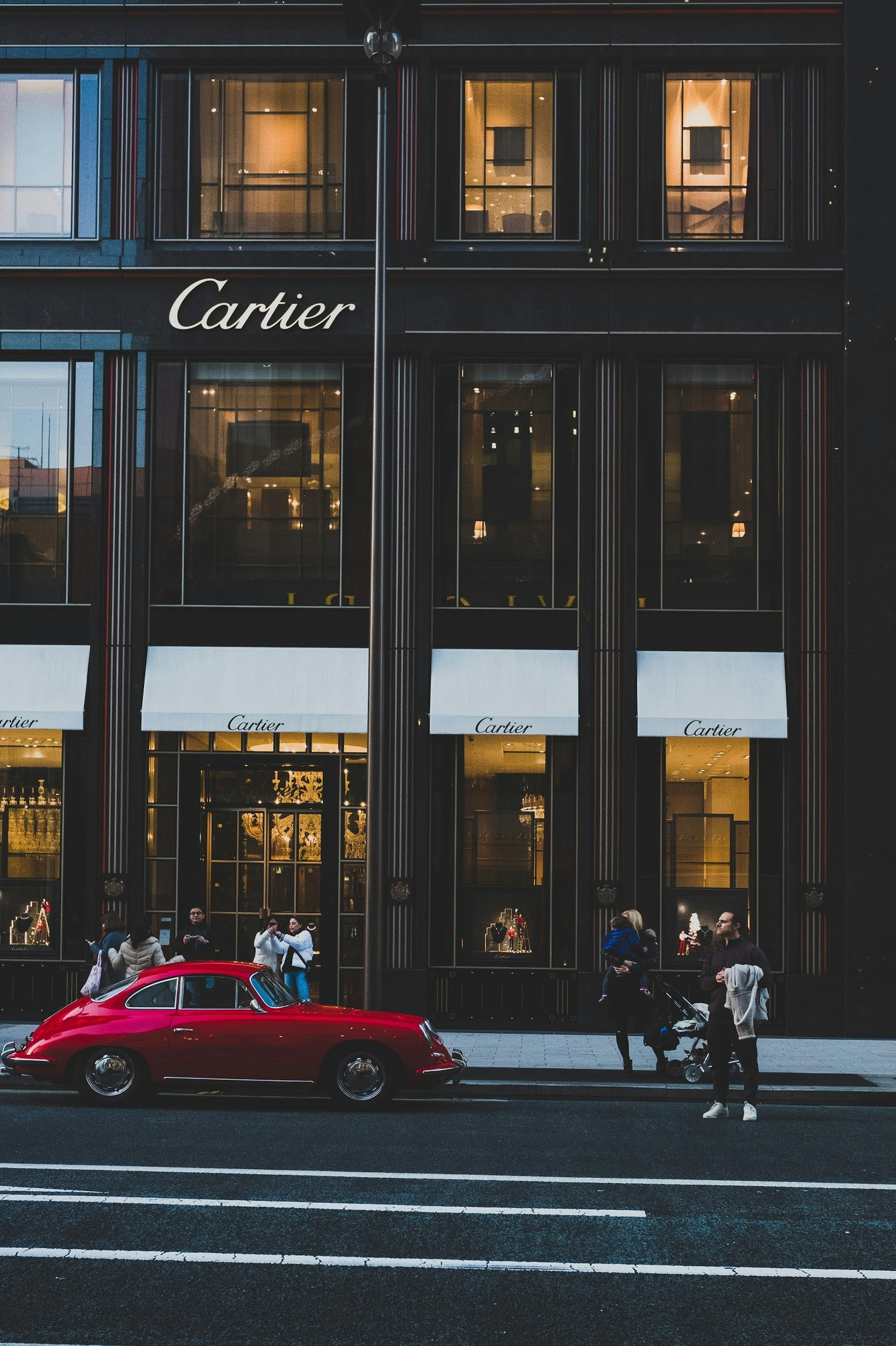 simon-launay-mKsFAzUhvwQ-unsplash - Turkey Family Holidays Red car infront of Cartier shop