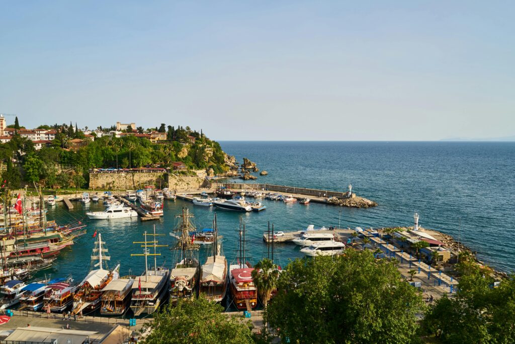 View of pile of Assorted-color Boats , Mountains and sea in Antalya.