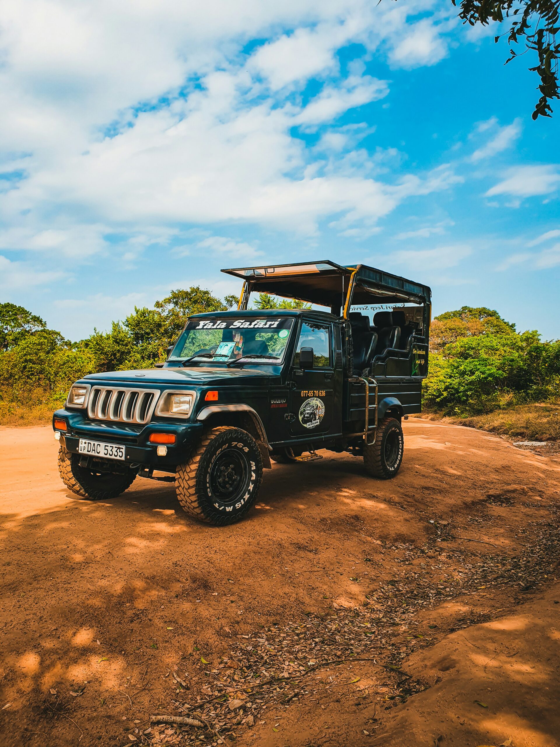 Black jeep wrangler on dirt road during daytime