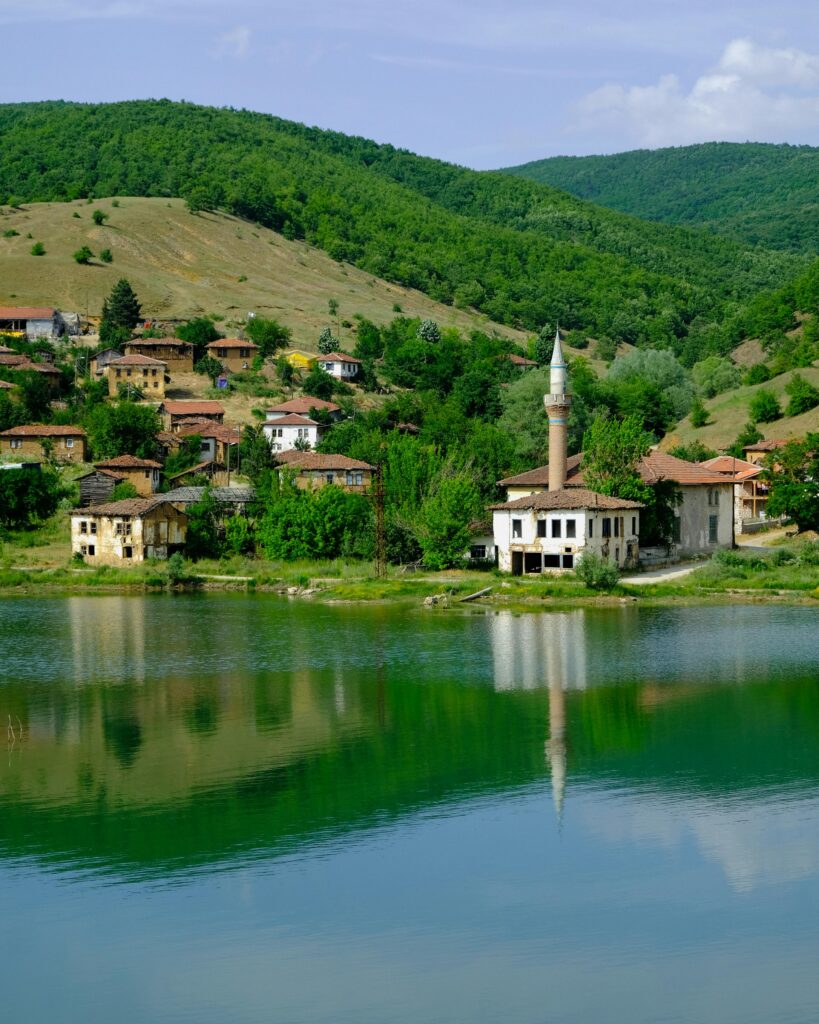 Village with a minaret in it on Lakeshore in Turkey