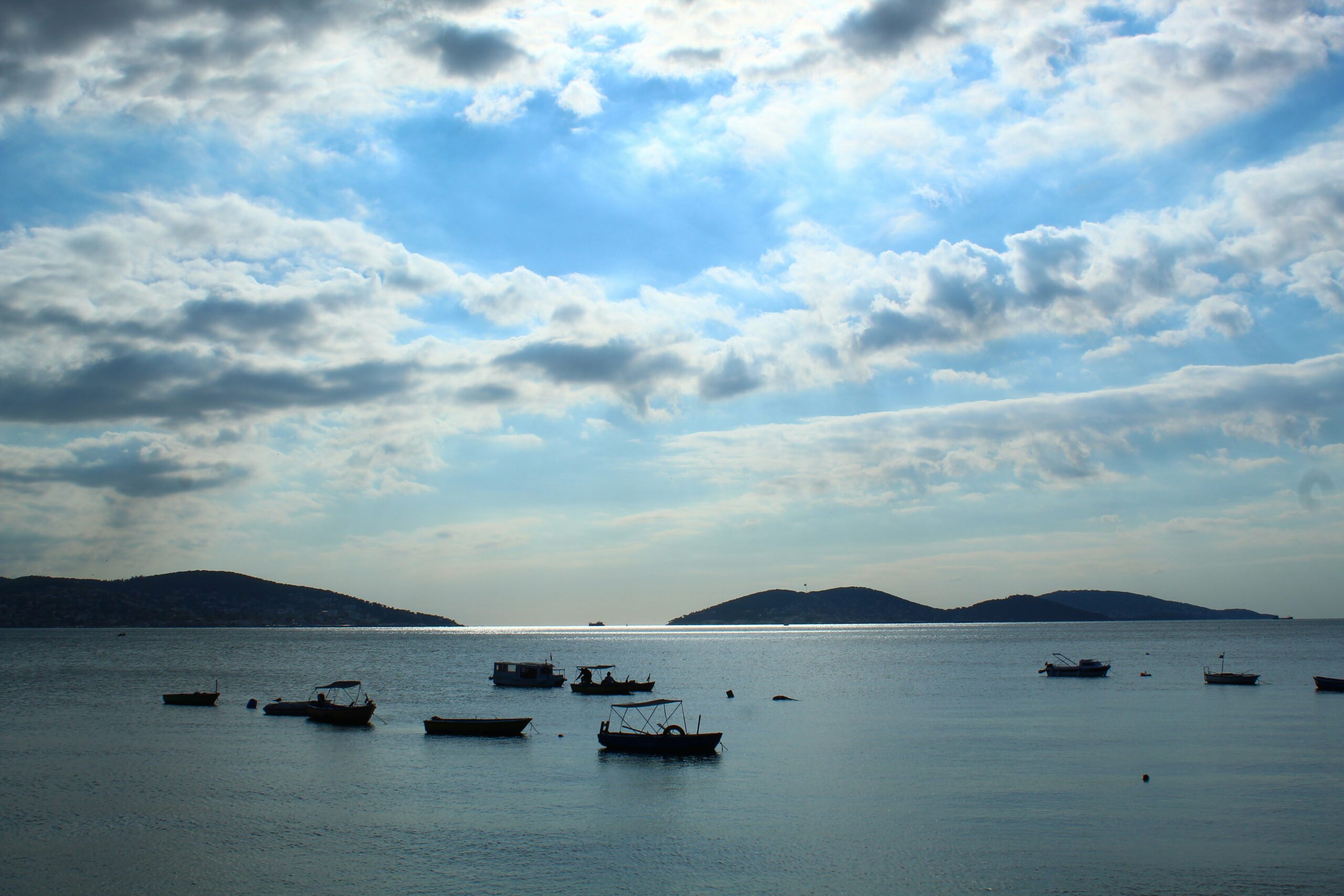 A group of boats on a body of water.